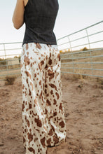 Load image into Gallery viewer, Cow Print Satin Pants
